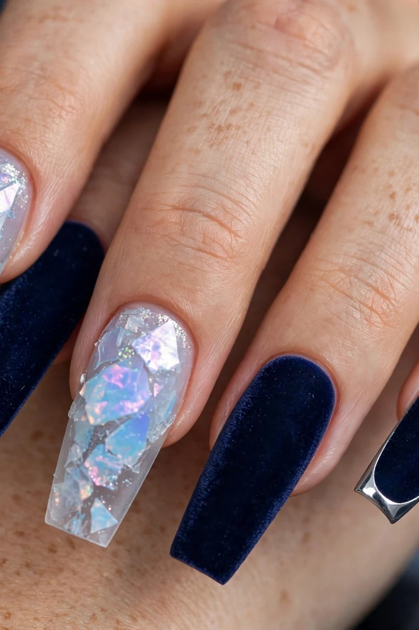 Icy blue frosted nails mixed with navy velvet nails and a silver chrome French tip