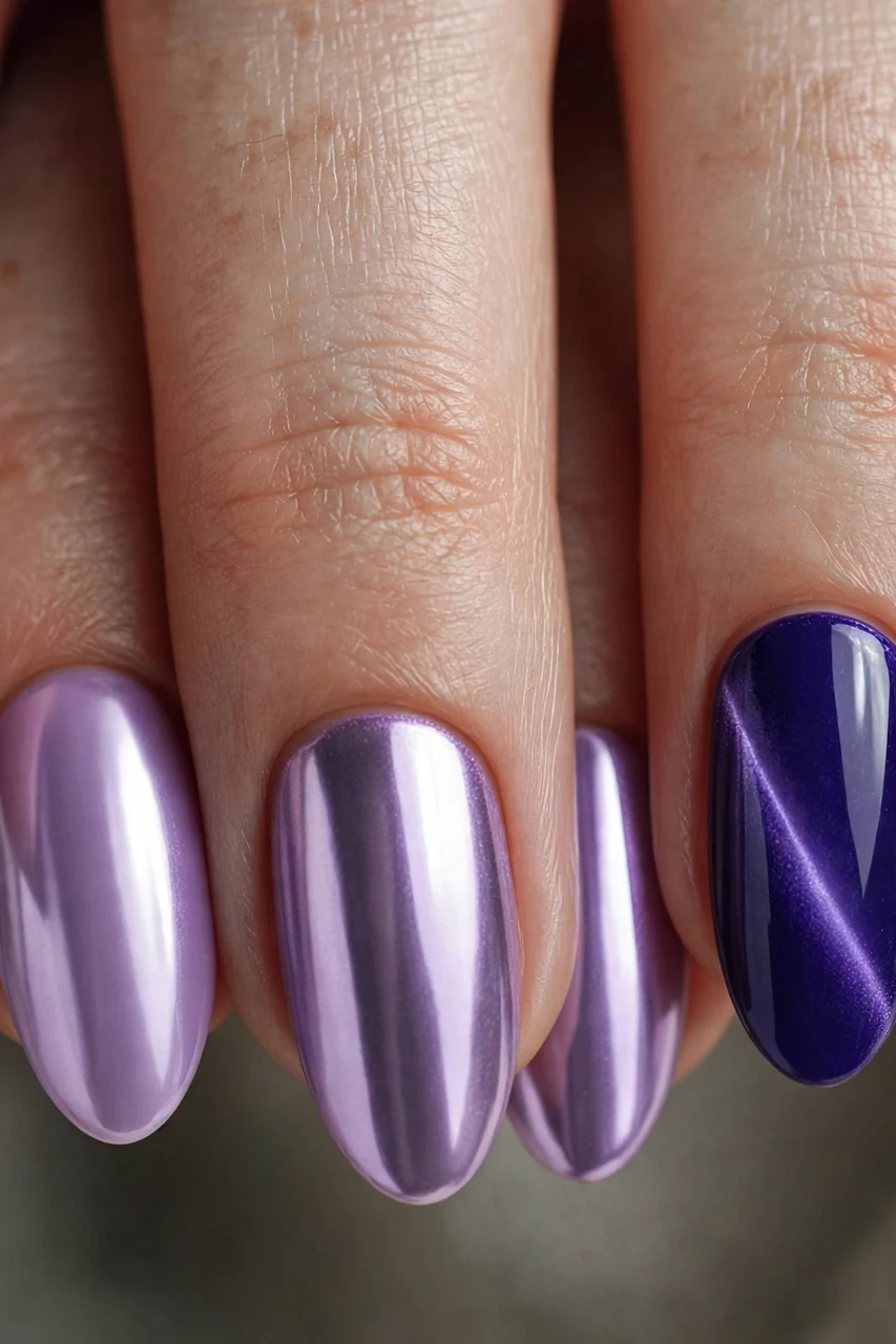 Royal purple cat-eye nails with lilac chrome in a mismatched Christmas set