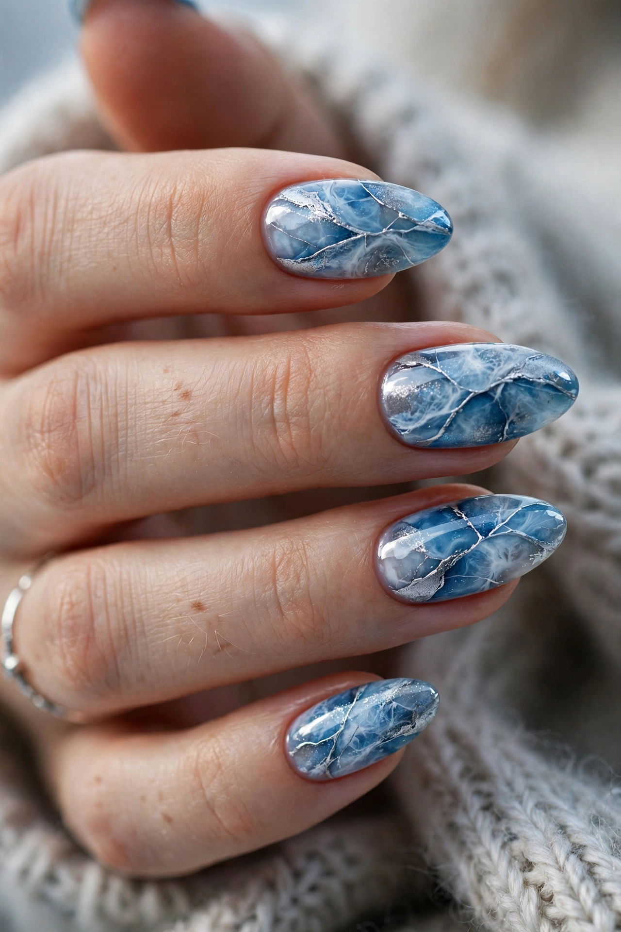 Icy blue marble Christmas nails frozen lake swirl design