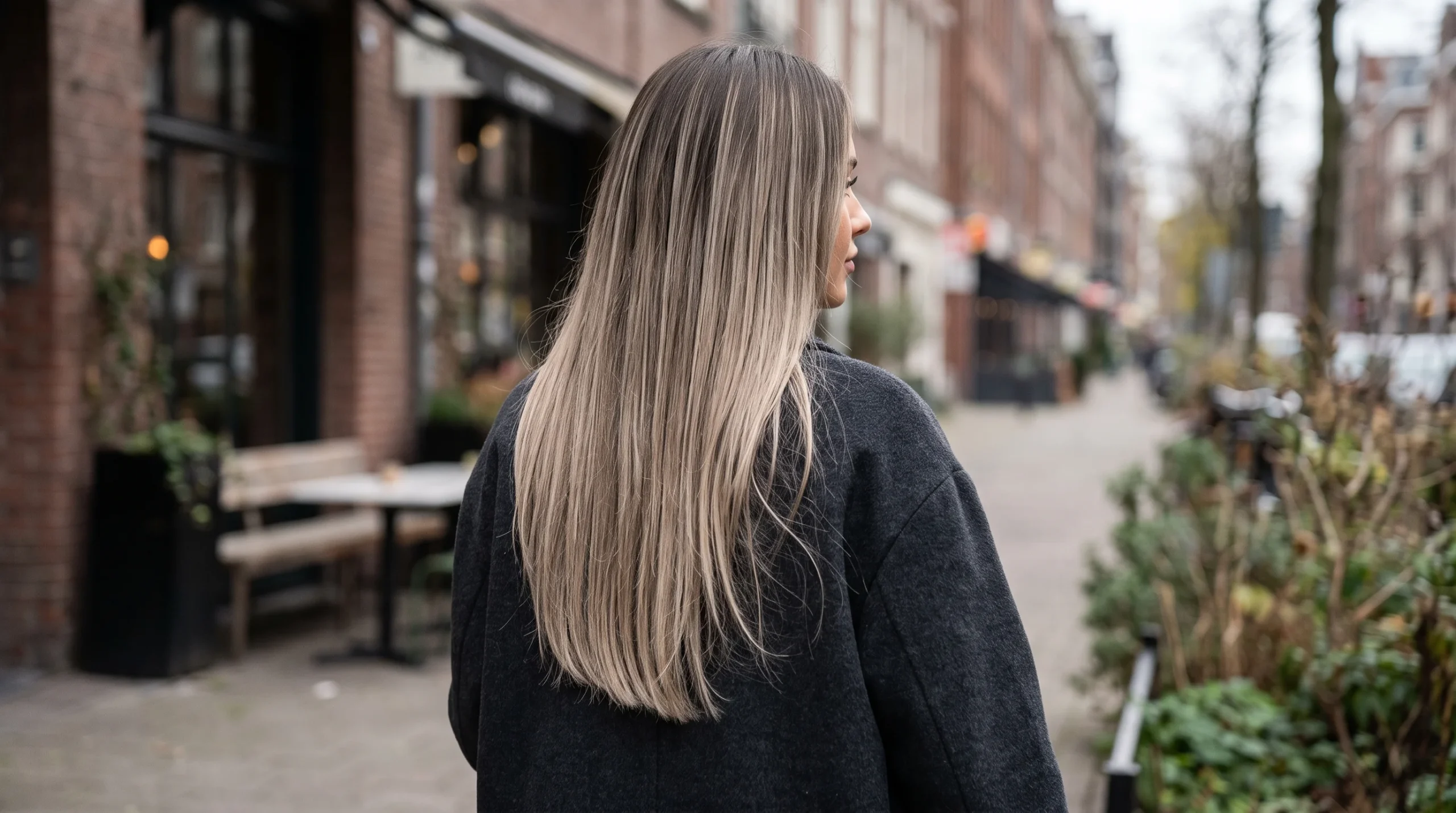 Mushroom lived in blonde balayage, cool mushroom-toned blonde ribbons over an ashy root on straight hair